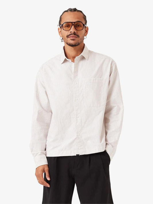 Image of a model wearing Tops. Productname: Zanerobe Overlap Crop Ls Shirt - White Pinstripe in White Pinstripe colour by brand - Zanerobe