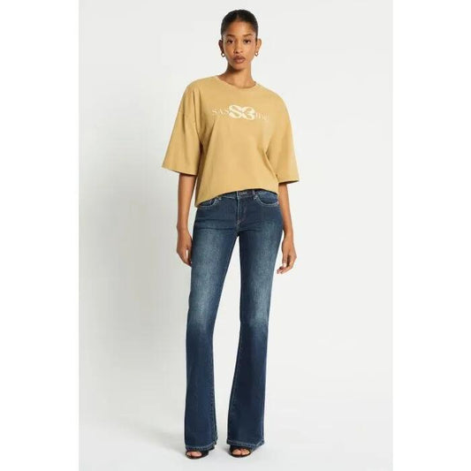 Image of a model wearing Denim. Productname: Vintage Low Rise Bootleg Jean in Indigo colour by brand - sass and bide