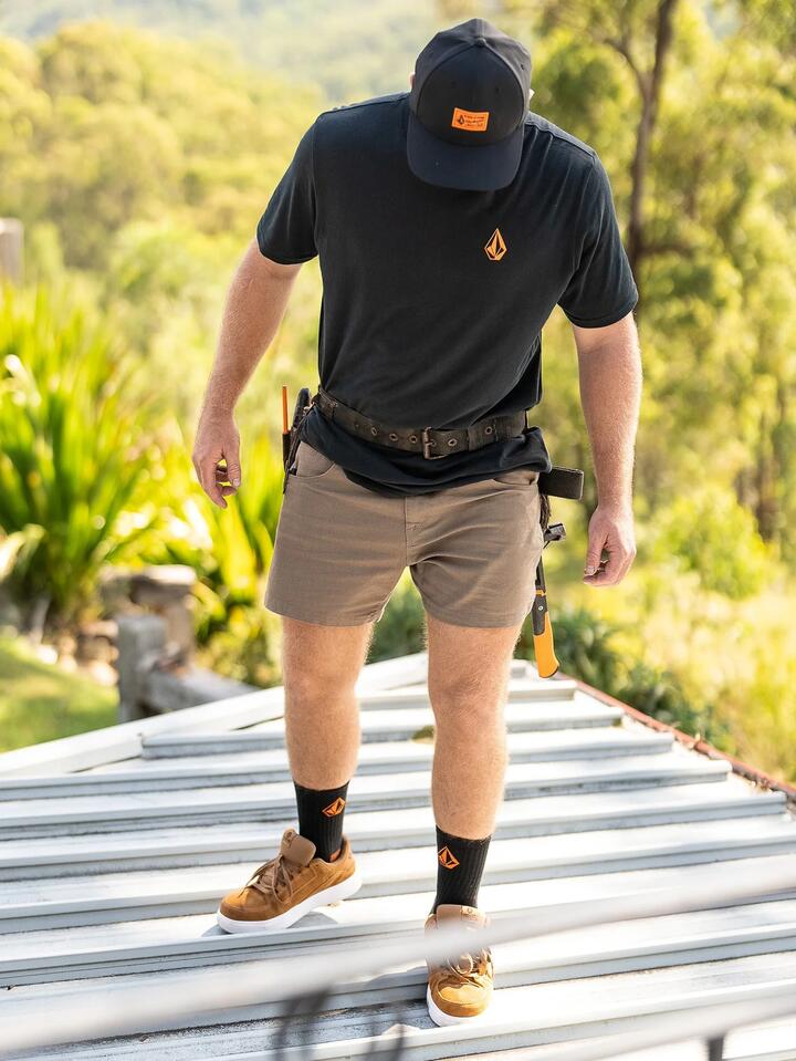 Image of a model wearing Uniforms & Workwear. Productname: Volcom - Mens Volcom Workwear Bevel 15" Carpenter Shorts - Brindle - in Brindle colour by brand - Volcom