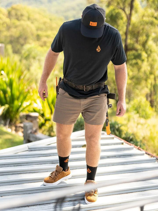 Image of a model wearing Uniforms & Workwear. Productname: Volcom - Mens Volcom Workwear Bevel 15" Carpenter Shorts - Brindle - in Brindle colour by brand - Volcom