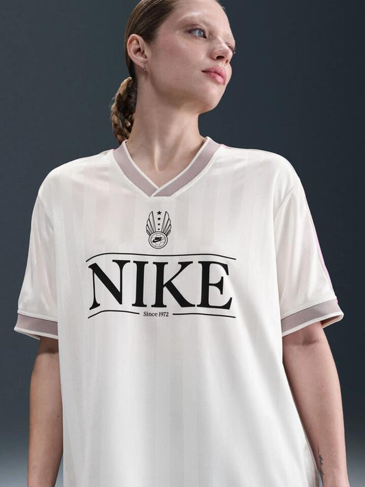 Image of a model wearing Tops. Productname: Nike NSW V Neck Jersey in Sail/Plyfl Pnk/Clg Gry/Blk colour by brand - Nike