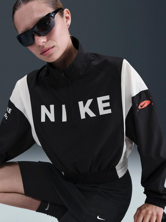 Image of a model wearing Outerwear. Productname: Nike NSW Woven Lightweight 1/4-Zip Jacket in Black/Black/Sail colour by brand - Nike