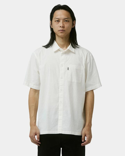 Image of a model wearing Tops. Productname: Former - Mens Legacy Short Sleeve Shirt - White - in White colour by brand - Former