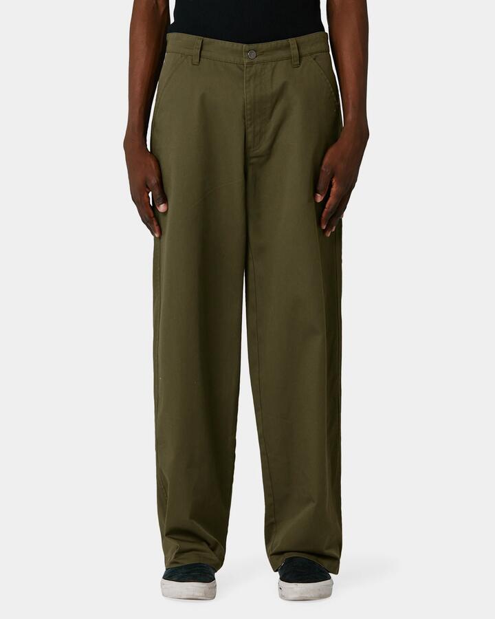 Image of a model wearing Pants. Product name - Former Mens Reynolds Work Pants Green in Green colour by brand - Former
