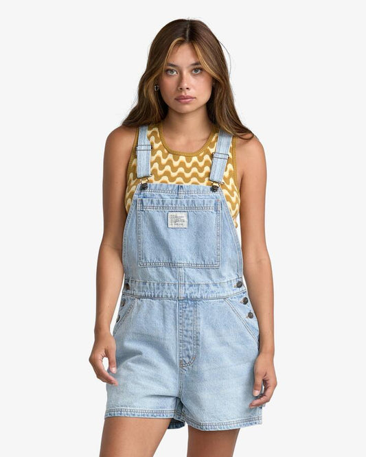 Image of a model wearing Pants. Productname: RVCA - Womens Drea Overalls - Bleached Indigo - in Bleached Indigo colour by brand - RVCA