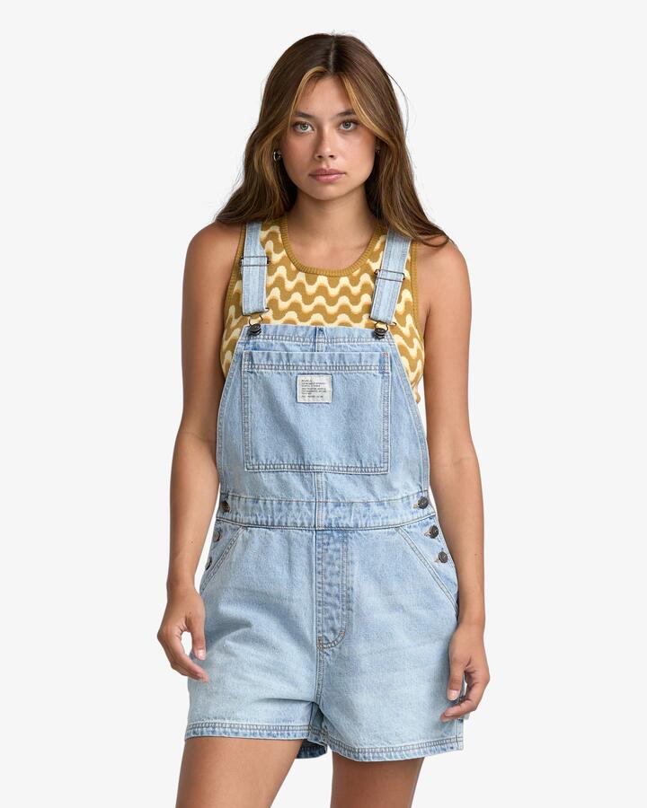 Image of a model wearing Pants. Product name - RVCA Womens Drea Overalls Bleached Indigo in Bleached Indigo colour by brand - RVCA