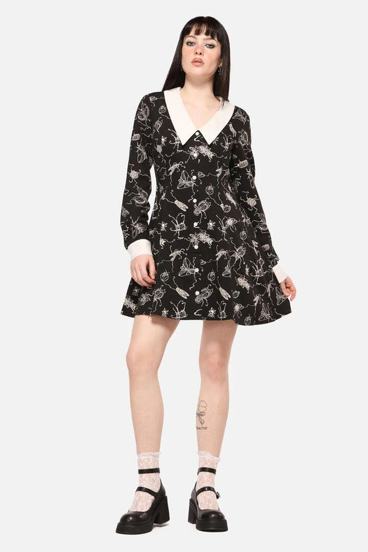 Image of a model wearing Dress. Productname: Dark Pieridae Print Long Sleeve Dress in Black colour by brand - Dangerfield