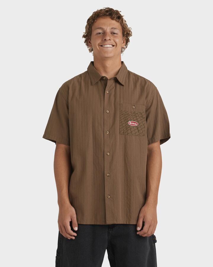 Image of a model wearing Tops. Productname: Billabong Mens Immortal Core Short Sleeve Shirt Gravel - in Gravel colour by brand - Billabong