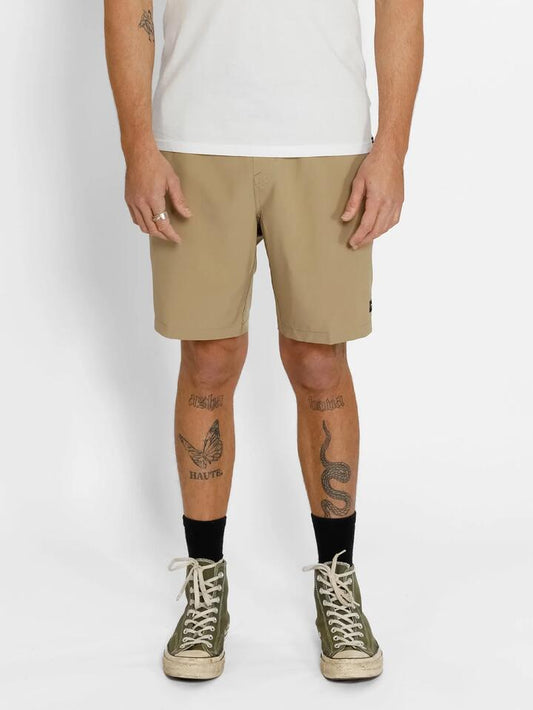 Image of a model wearing Shorts. Productname: Volcom Mens Stones 18" Hybrid Shorts Khaki - in Khaki colour by brand - Volcom