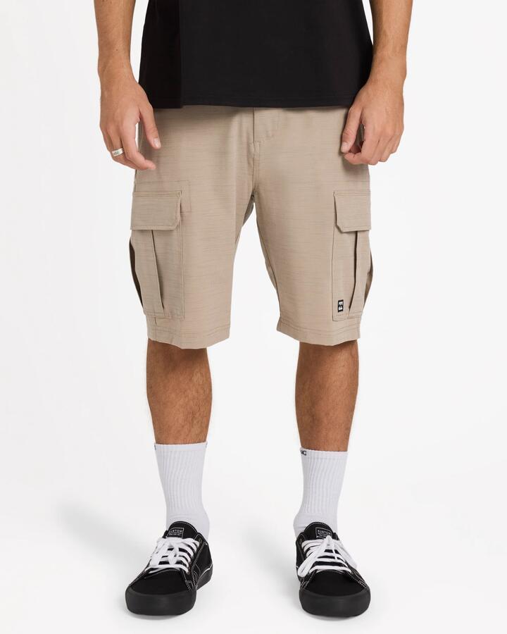 Image of a model wearing Shorts. Product name - Billabong Mens Scheme X Hybrid 21" Shorts Khaki in Khaki colour by brand - Billabong