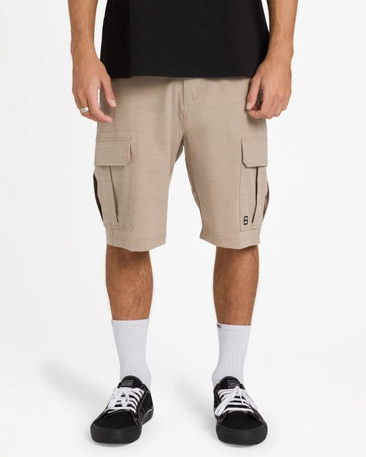 Image of a model wearing Shorts. Product name - Billabong Mens Scheme X Hybrid 21" Shorts Khaki in Khaki colour by brand - Billabong