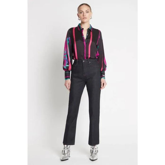 Image of a model wearing Denim. Productname: The Inferno Jean in TRUE INDIGO + MAGENTA TOPSTITC colour by brand - sass and bide