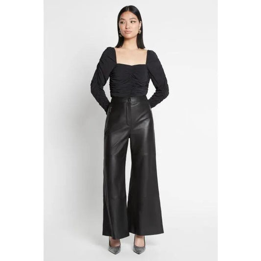 Image of a model wearing Tops. Productname: Above The Sea Top in Black colour by brand - sass and bide