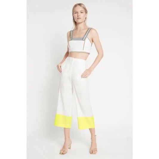 Image of a model wearing Tops. Productname: Pretty With Patience Crop Top in Ivory colour by brand - sass and bide