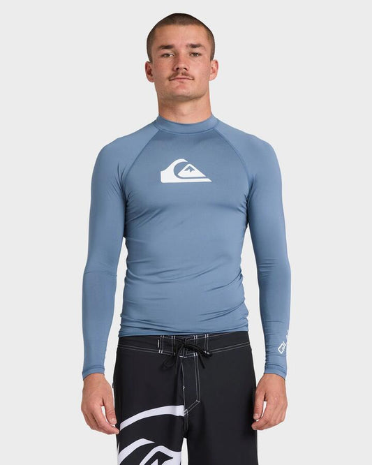 Image of a model wearing Tops. Productname: Quiksilver Mens All Time Long Sleeve Rash Vest China Blue - in China Blue colour by brand - Quiksilver