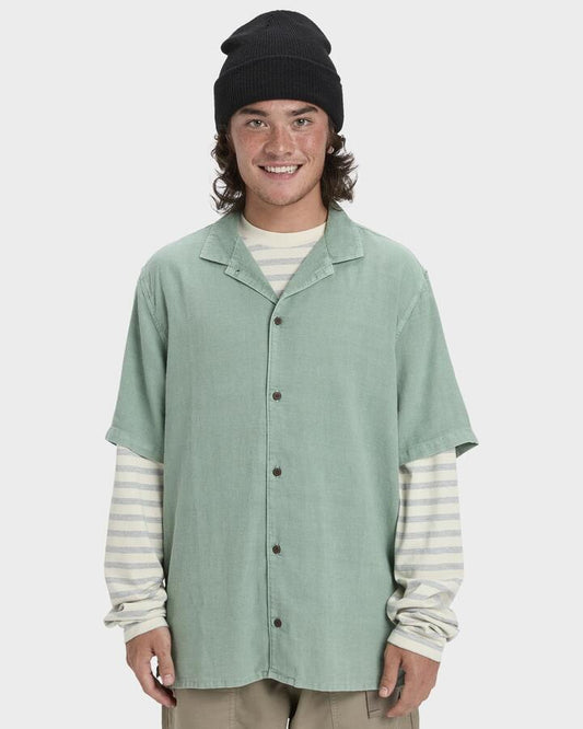 Image of a model wearing Tops. Productname: Quiksilver Mens Sunrise Short Sleeve Shirt Granite Green - in Granite Green colour by brand - Quiksilver