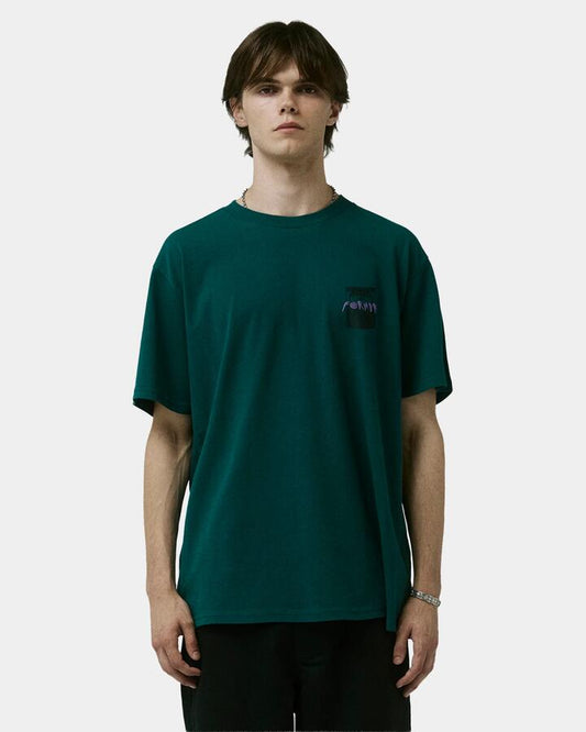 Image of a model wearing Tops. Productname: Former Mens Droid Crux T-Shirt Green - in Green colour by brand - Former