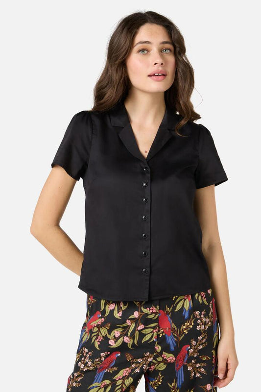 Image of a model wearing Shorts. Productname: Lara Short Sleeve Blouse in Black colour by brand - Princess Highway