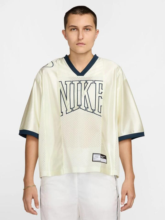 Image of a model wearing Shorts. Productname: Nike Women's Short-Sleeve Graphic Jersey in Sail/Armory Navy colour by brand - Nike