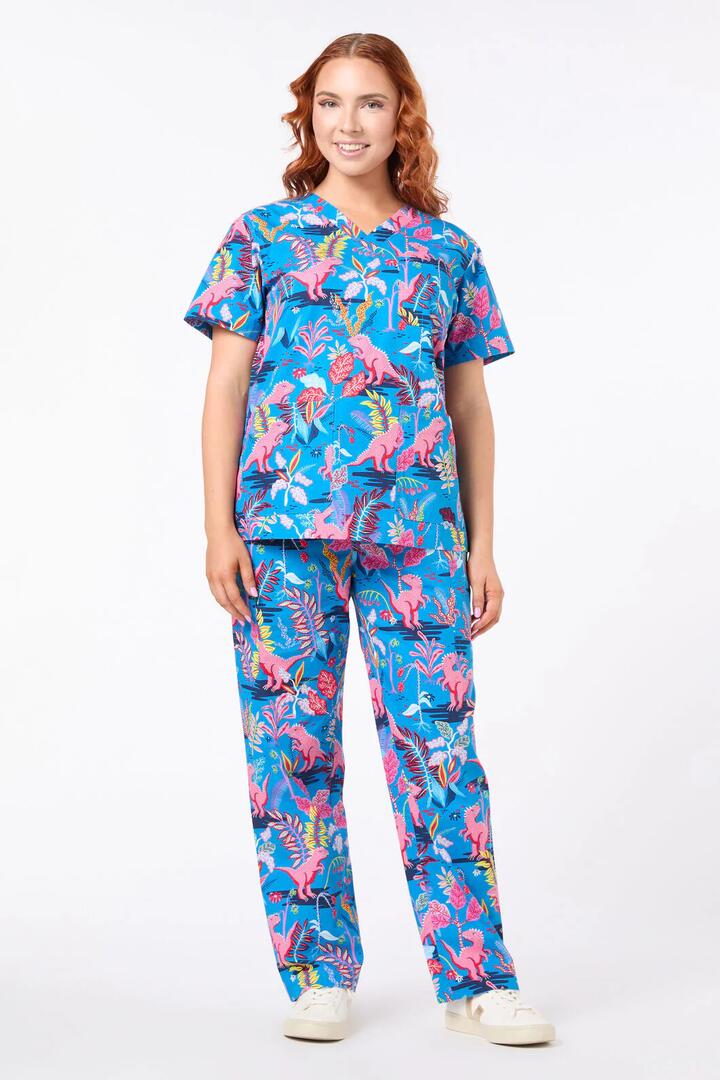 Image of a model wearing Uniforms & Workwear. Product name - Dino Forest Scrub set in Multi colour by brand - Scrubs With Love