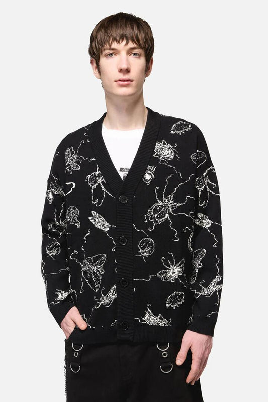 Image of a model wearing Outerwear. Productname: Dark Pieridae Knit Cardi in Black colour by brand - Dangerfield