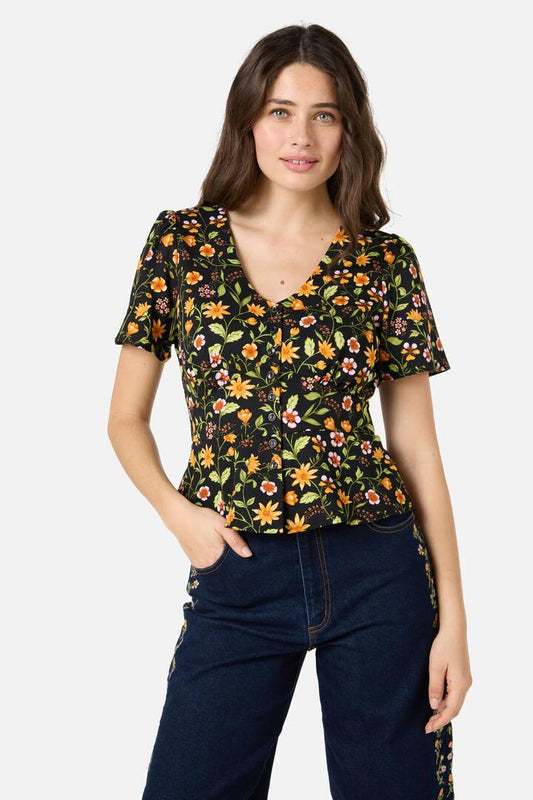 Image of a model wearing Tops. Productname: Alyssa Floral Peplum Top in Black colour by brand - Princess Highway