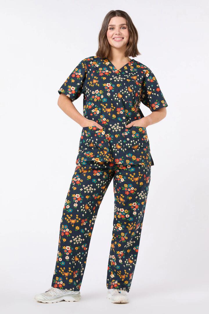 Image of a model wearing Uniforms & Workwear. Productname: Cute Chickens Scrub Set in Navy colour by brand - Scrubs With Love