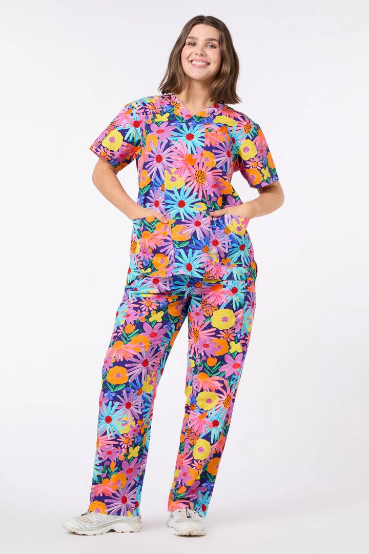 Image of a model wearing Uniforms & Workwear. Productname: Botanica Scrub Set in Navy colour by brand - Scrubs With Love