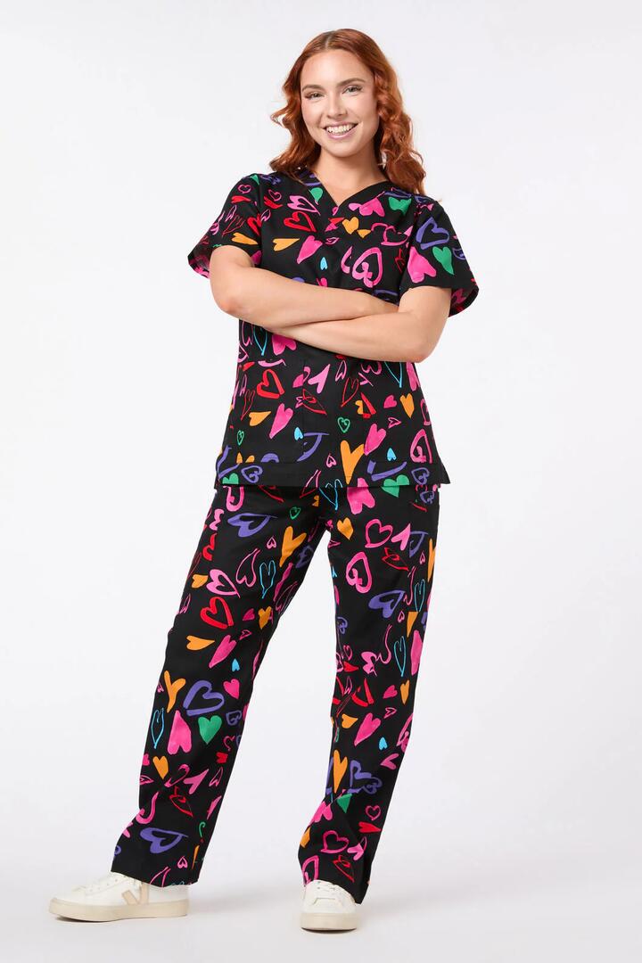 Image of a model wearing Uniforms & Workwear. Product name - Heartfull Scrub Set in Black colour by brand - Gorman