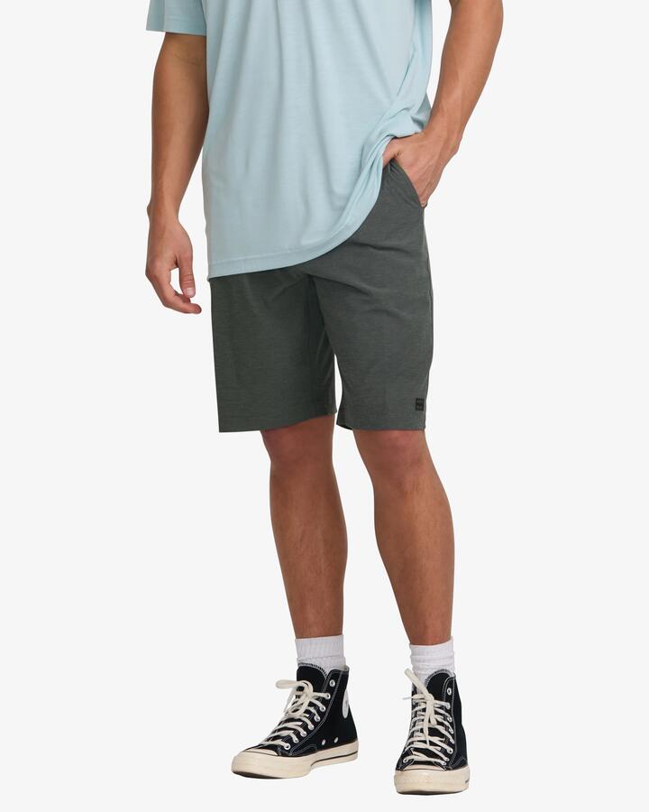Image of a model wearing Shorts. Product name - Billabong Mens Crossfire 21" Hybrid Shorts Asphalt in Asphalt colour by brand - Billabong