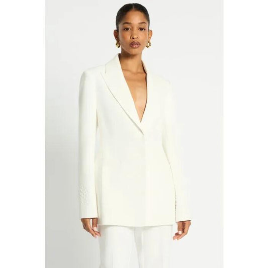 Image of a model wearing Outerwear. Productname: Alatra Blazer in Ivory colour by brand - sass and bide