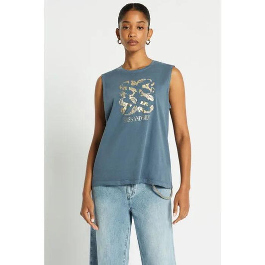 Image of a model wearing Tops. Productname: Indiana Muscle Tank in Washed Indigo colour by brand - sass and bide