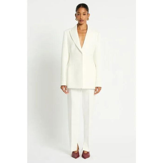 Image of a model wearing Pants. Productname: Alatra Pants in Ivory colour by brand - sass and bide