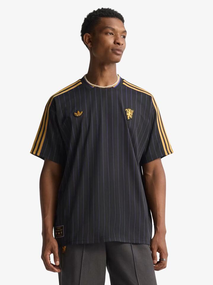 Image of a model wearing Tops. Productname: Adidas Manchester United Terrace Icons Jersey in Black colour by brand - Adidas