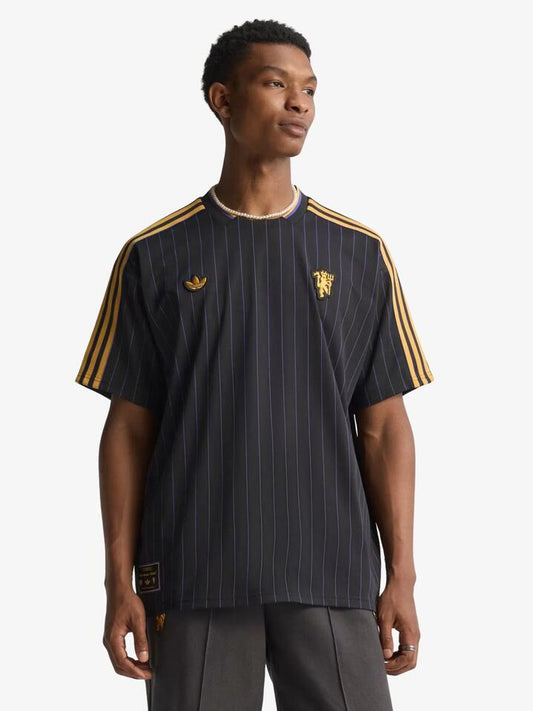 Image of a model wearing Tops. Productname: Adidas Manchester United Terrace Icons Jersey in Black colour by brand - Adidas