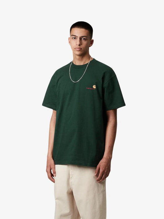 Image of a model wearing Tops. Productname: Carhartt Wip S/S American Script T-Shirt in Conifer colour by brand - Carhartt Wip