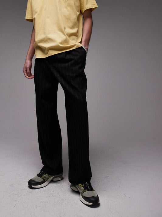 Image of a model wearing Pants. Productname: Topman Pinstripe Wide Leg Trousers in Black colour by brand - Topman
