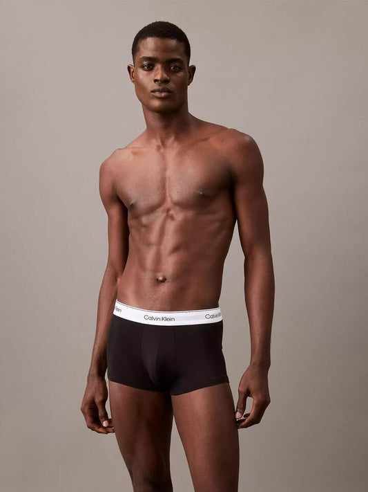Image of a model wearing Shorts. Productname: Calvin Klein Icon Cotton Stretch Low Rise Trunks (Black 3-Pack) in Black/Black/Black colour by brand - Calvin Klein