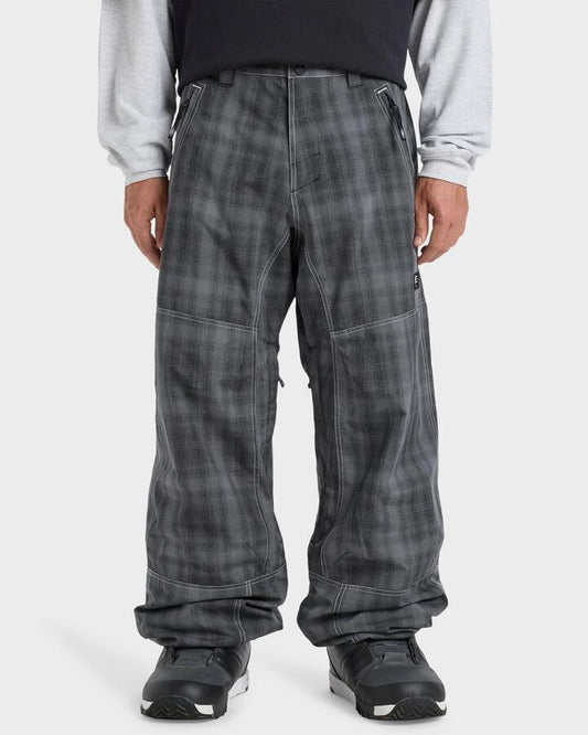 Image of a model wearing Pants. Product name - Quiksilver Mens Live Wire Snow Pants Mercury Check True Black in Mercury Check True Black colour by brand - Quiksilver