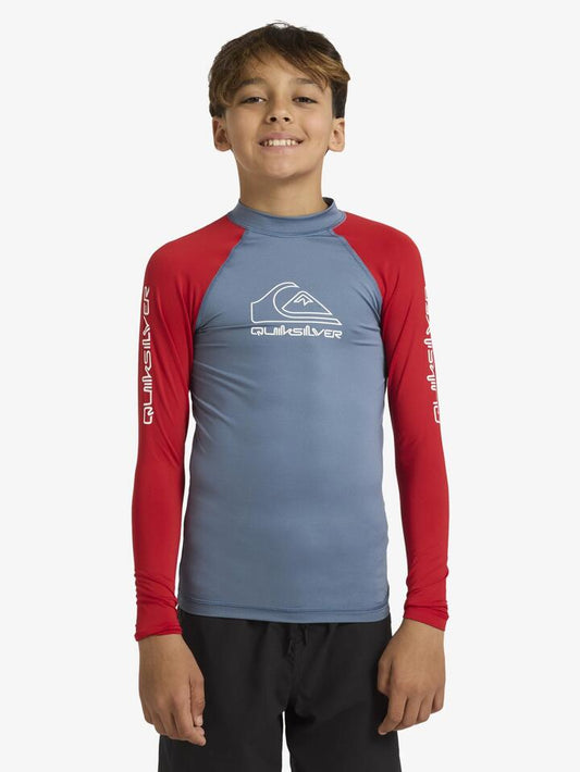 Image of a model wearing Tops. Product name - Quiksilver Boys 8-16 On Tour Long Sleeve Rash Vest Salsa in Salsa colour by brand - Quiksilver