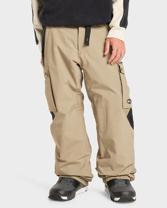 Image of a model wearing Pants. Productname: Quiksilver - Mens Snow Down Cargo Snow Pants - Fallen Rock Ripstop - in Fallen Rock Ripstop colour by brand - Quiksilver