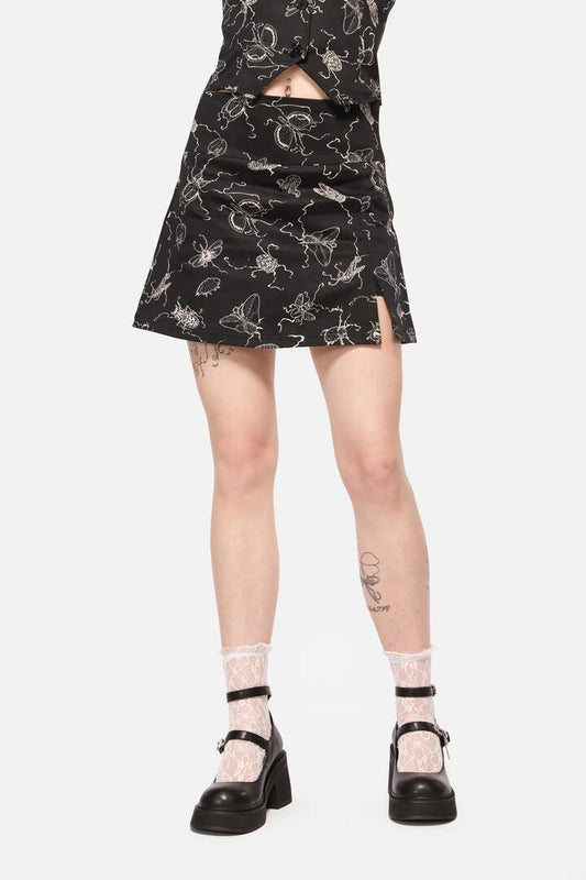 Image of a model wearing Skirts. Productname: Dark Pieridae Print Skort in Black colour by brand - Dangerfield