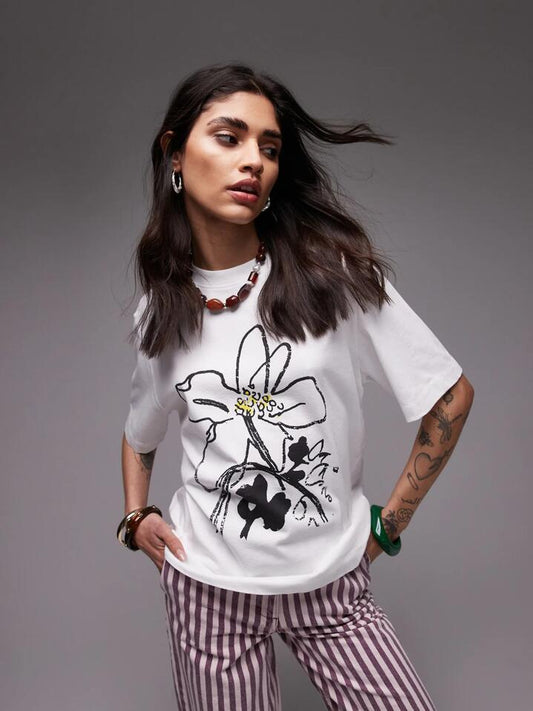 Image of a model wearing Tops. Productname: Topshop Shrunken Floral Tee in WHITE colour by brand - Topshop
