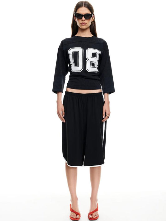 Image of a model wearing Shorts. Productname: Lioness Spectate Shorts in Onyx colour by brand - Lioness