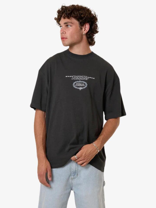 Image of a model wearing Tops. Productname: Thrills Infinite Dopamine Box Fit Oversize Tee in Black colour by brand - Thrills