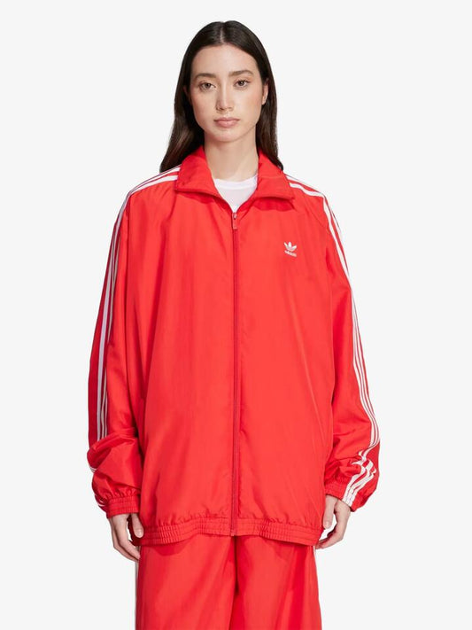 Image of a model wearing Tops. Productname: Adidas Adilenium Season 3 Oversized Track Top in better scarlet colour by brand - Adidas
