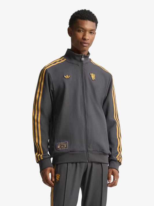 Image of a model wearing Tops. Productname: Adidas MUFC Icon Track Top in Utility Black colour by brand - Adidas