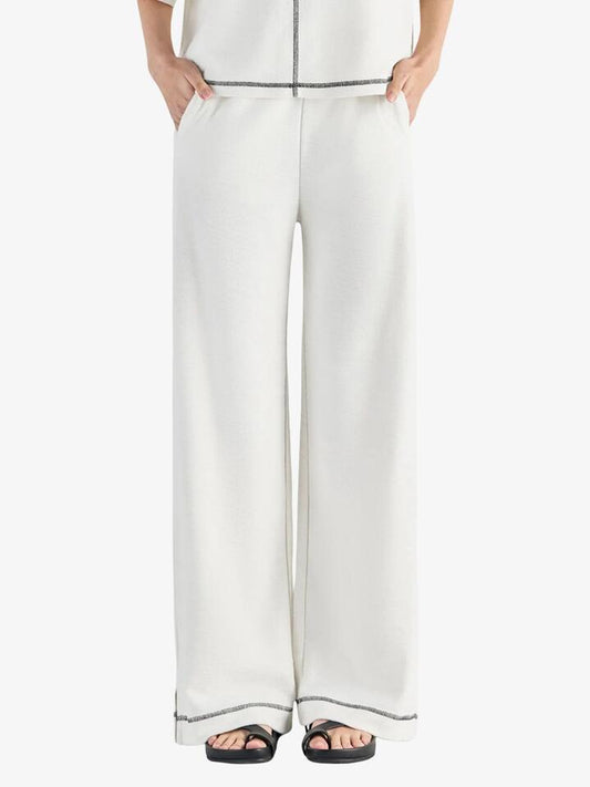 Image of a model wearing Pants. Productname: Nude Lucy Sutton Pants in Salt colour by brand - Nude Lucy
