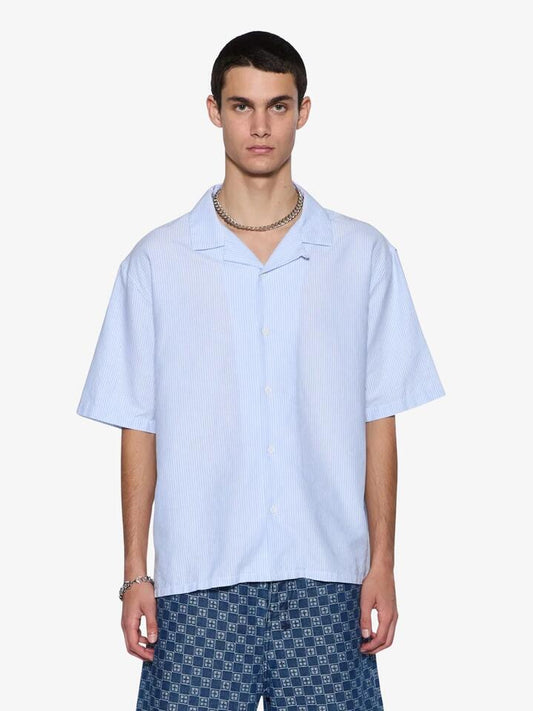 Image of a model wearing Shorts. Productname: Ksubi Caring Diner Short Sleeve Shirt in True Stripe colour by brand - Ksubi