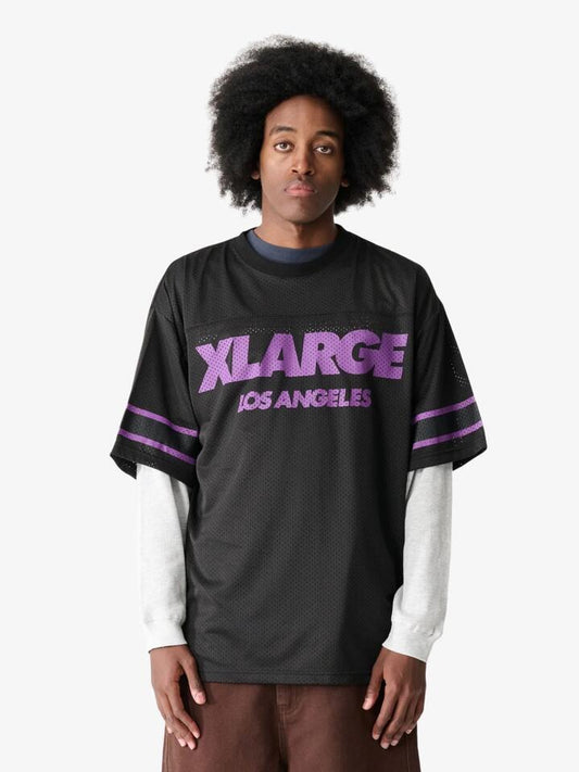 Image of a model wearing Tops. Productname: Xlarge Burning Peace Match Tee in BLACK colour by brand - Xlarge